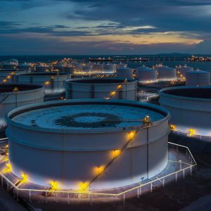 Aerial view oil storage tank terminal and tanker, petrol industrial zone.